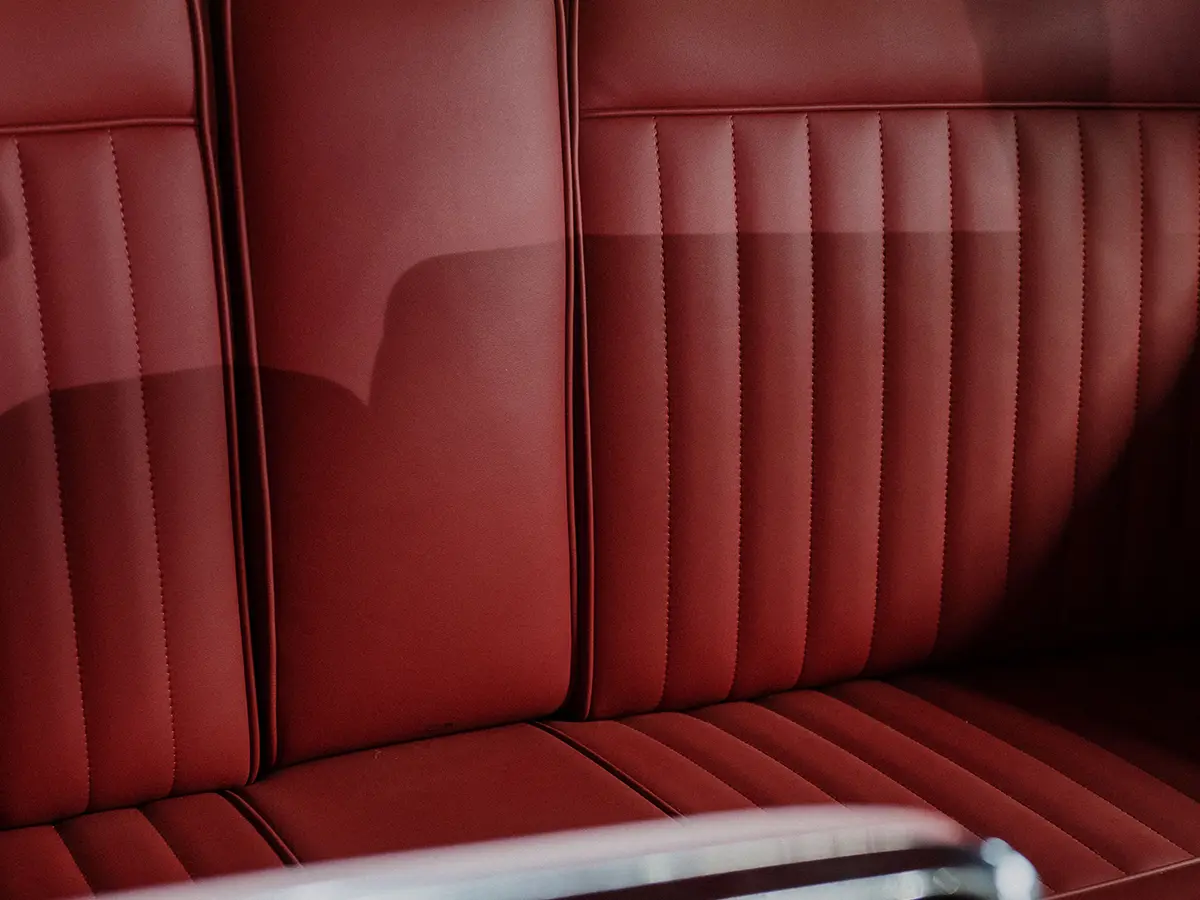 Before — worn factory seats